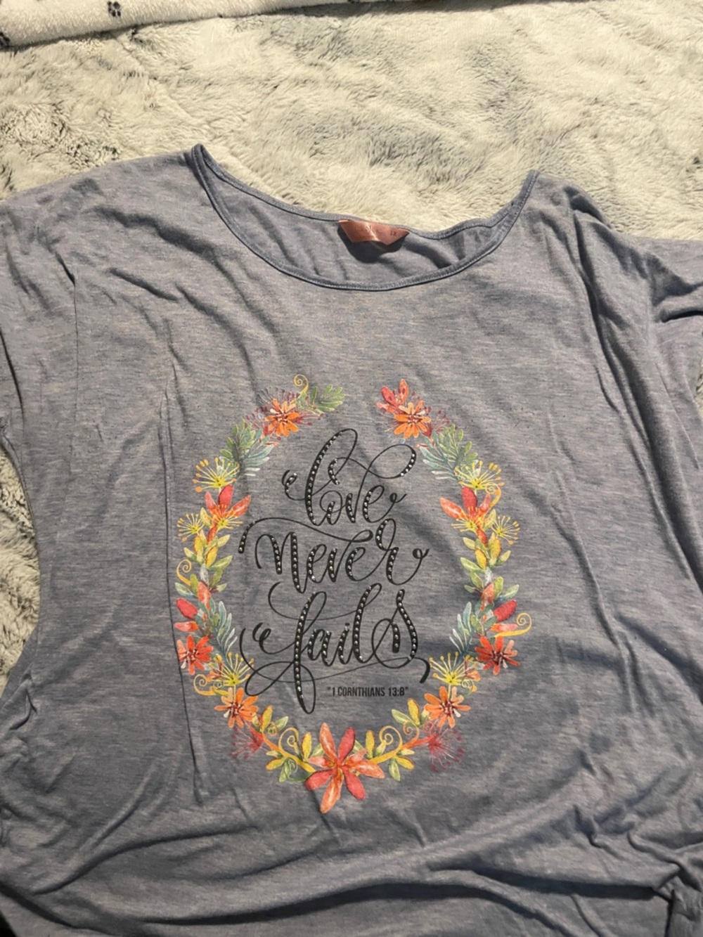 Women’s Heather Blue Graphic Tee - "Love Never Fails"